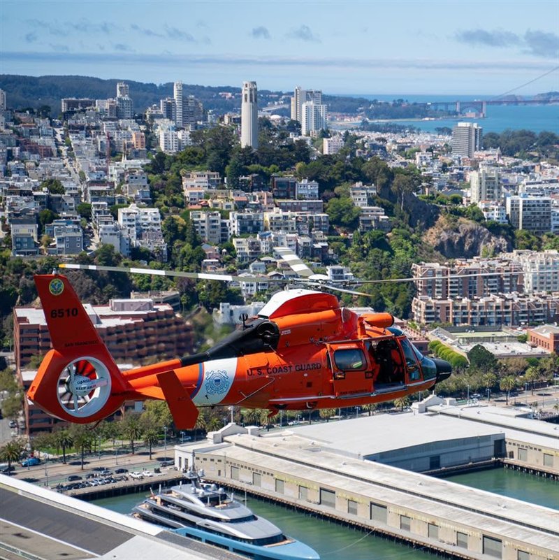 Coast Guard MH-65 Dolphin helicopter flying over San Francisco